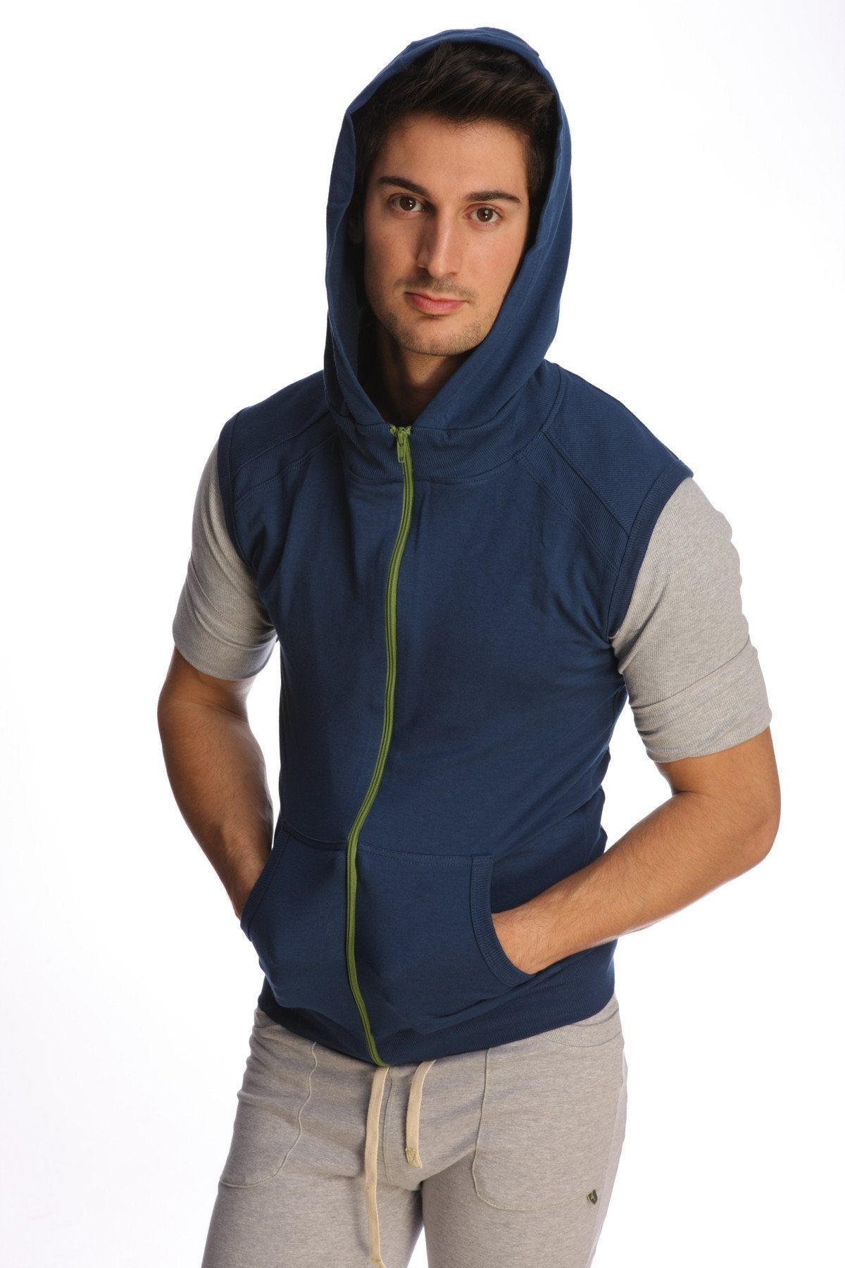 Sleeveless yoga hoodie in navy blue with lime green zipper and gray short sleeves designed for comfort and flexibility