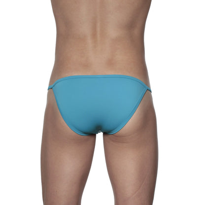 A sleek solid teal groovin string bikini solid fabric finish in a brief style swimsuit perfect for swimming