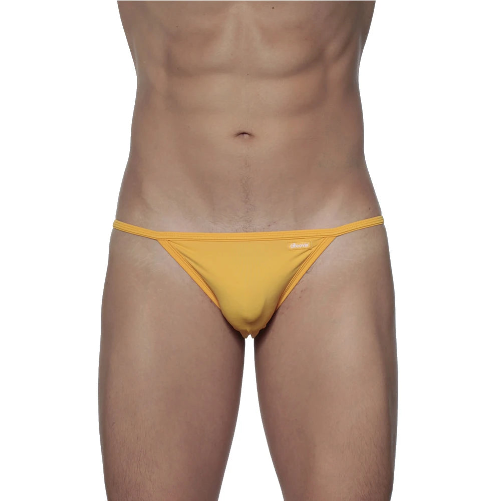 Yellow thong groovin string bikini golden yellow made of smooth stretchy fabric with minimalist design and subtle branding