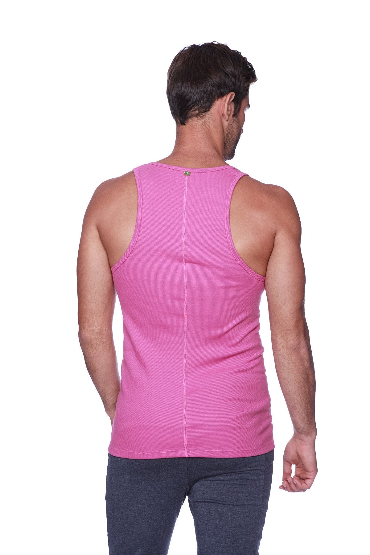 A vibrant berry pink sleeveless sustain tank made of smooth stretchy fabric shown from the back with a central seam