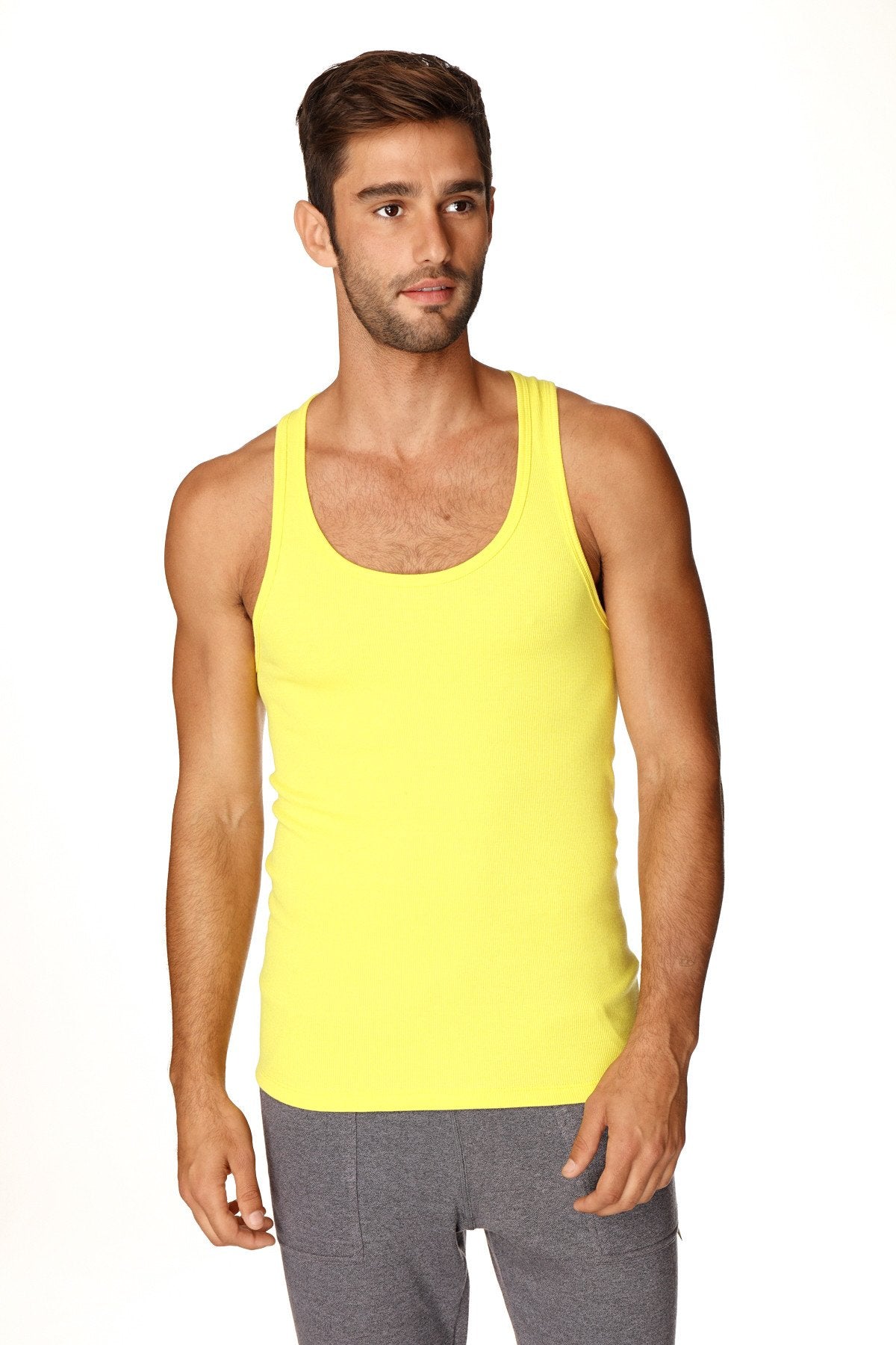 Bright yellow sleeveless sustain tank top with a simple fitted design perfect for casual wear in tropic yellow