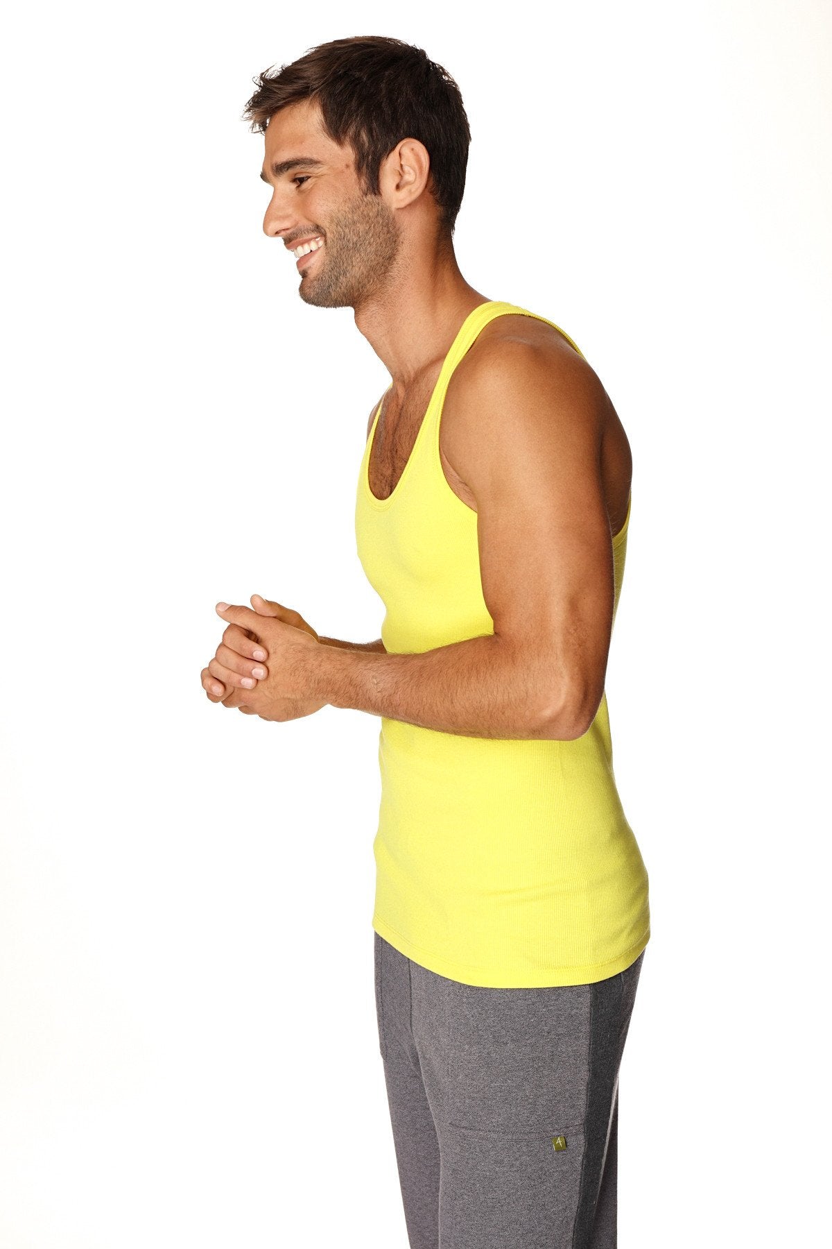 Bright yellow sleeveless Sustain Tank Top in tropic yellow with a rounded neckline and fitted cut for casual wear