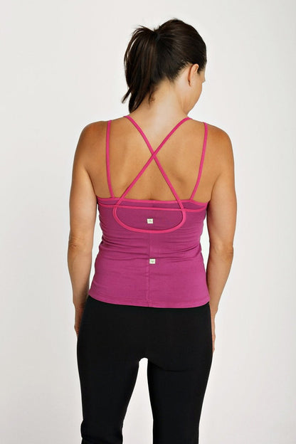 Fuchsia crossback sports bra sustain yoga halter with mesh panel and adjustable straps shown from the back