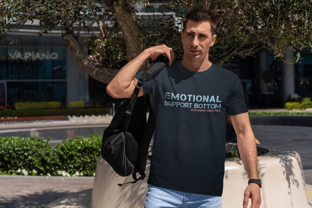 Dark navy blue short-sleeved t-shirt with white emotional support bottom text and smaller red text below, front view