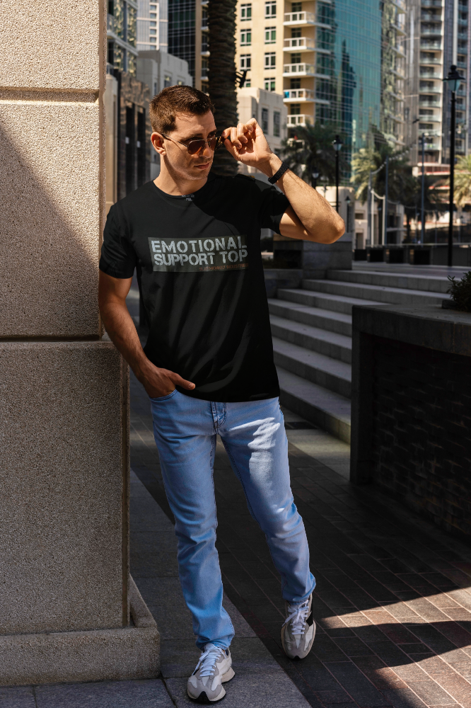 Black short-sleeved cotton t-shirt with emotional support top printed in white and gray across the chest