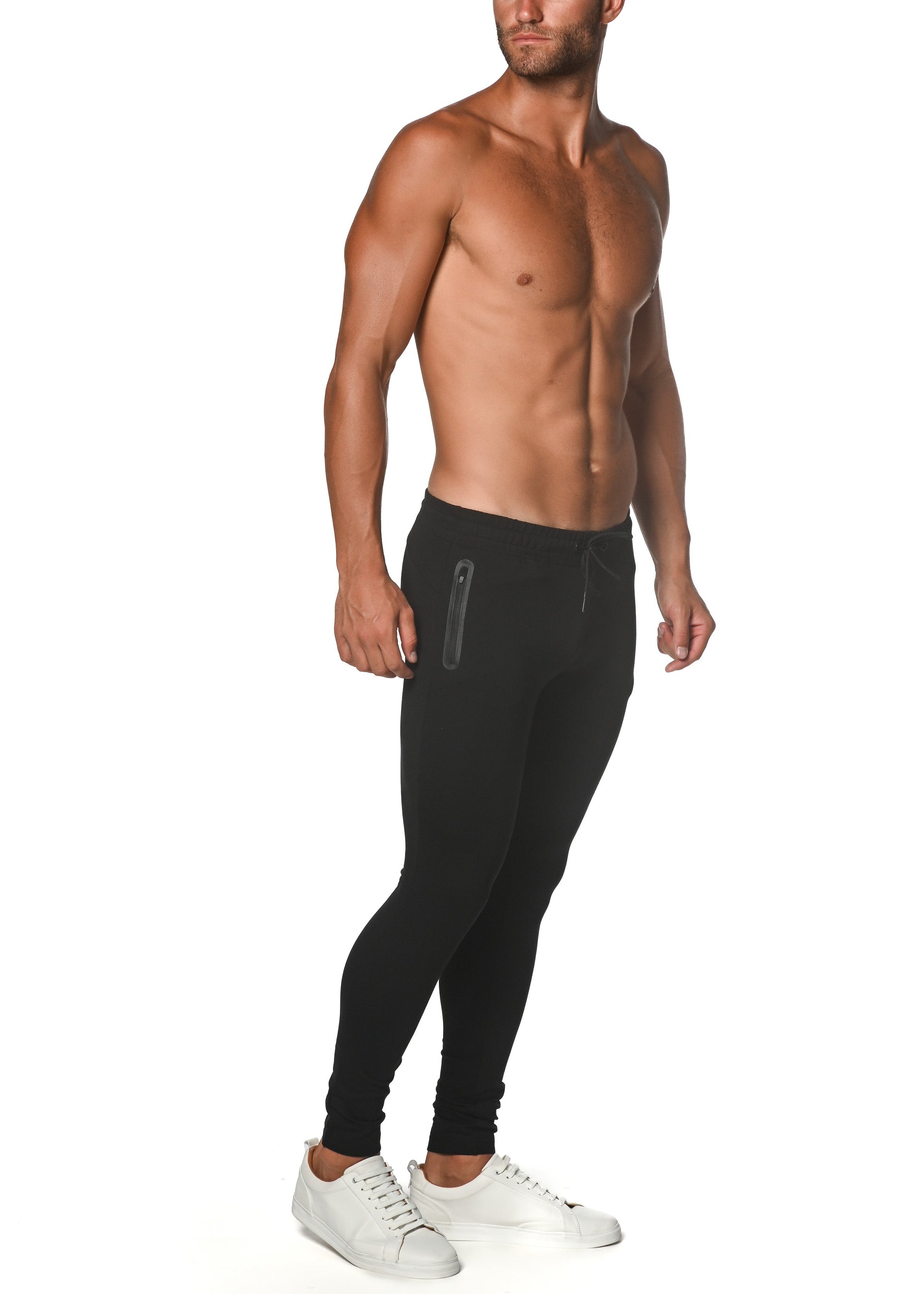 Black tactical gym-tech stretch slim jogger featuring sleek form-fitting design and subtle side zipper pockets