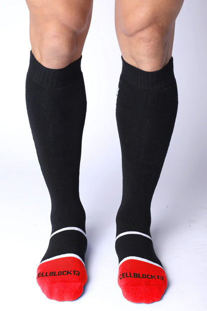 Take down knee high black compression socks with red toe caps white trim and cellblock13 logo on each foot