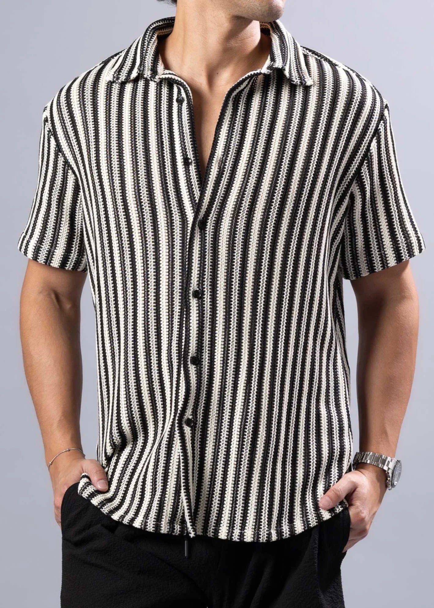 Black and white vertically striped short-sleeved button-up shirt with textured knit pattern called texture knit s/s shirt
