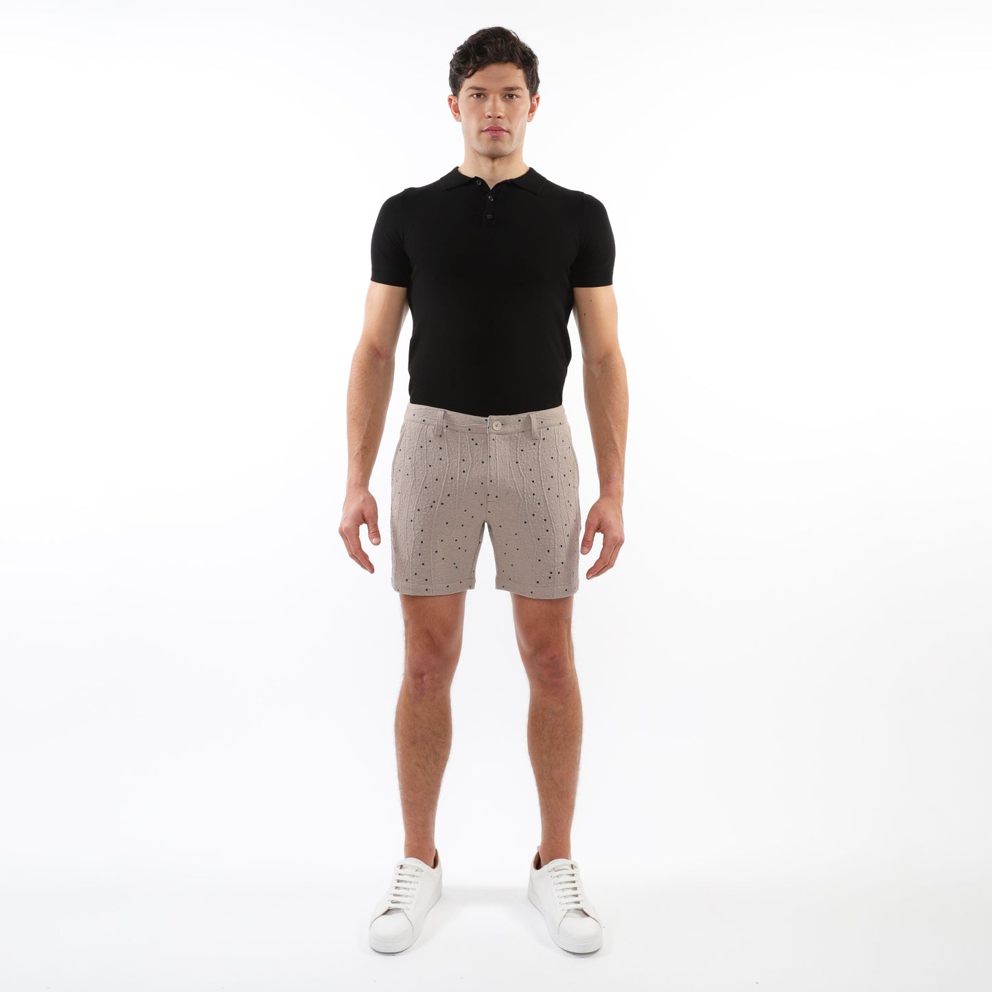Beige textured jacquard stretch chino shorts with subtle black dot pattern button fly and belt loops