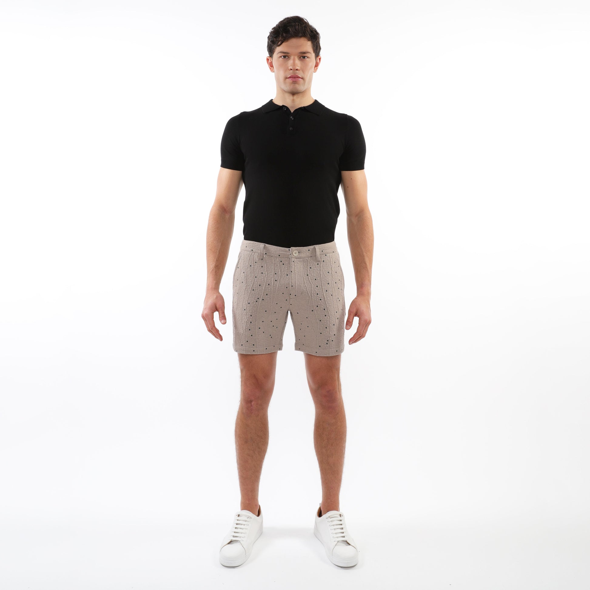 Beige textured jacquard stretch chino shorts with subtle black dot pattern button fly and belt loops