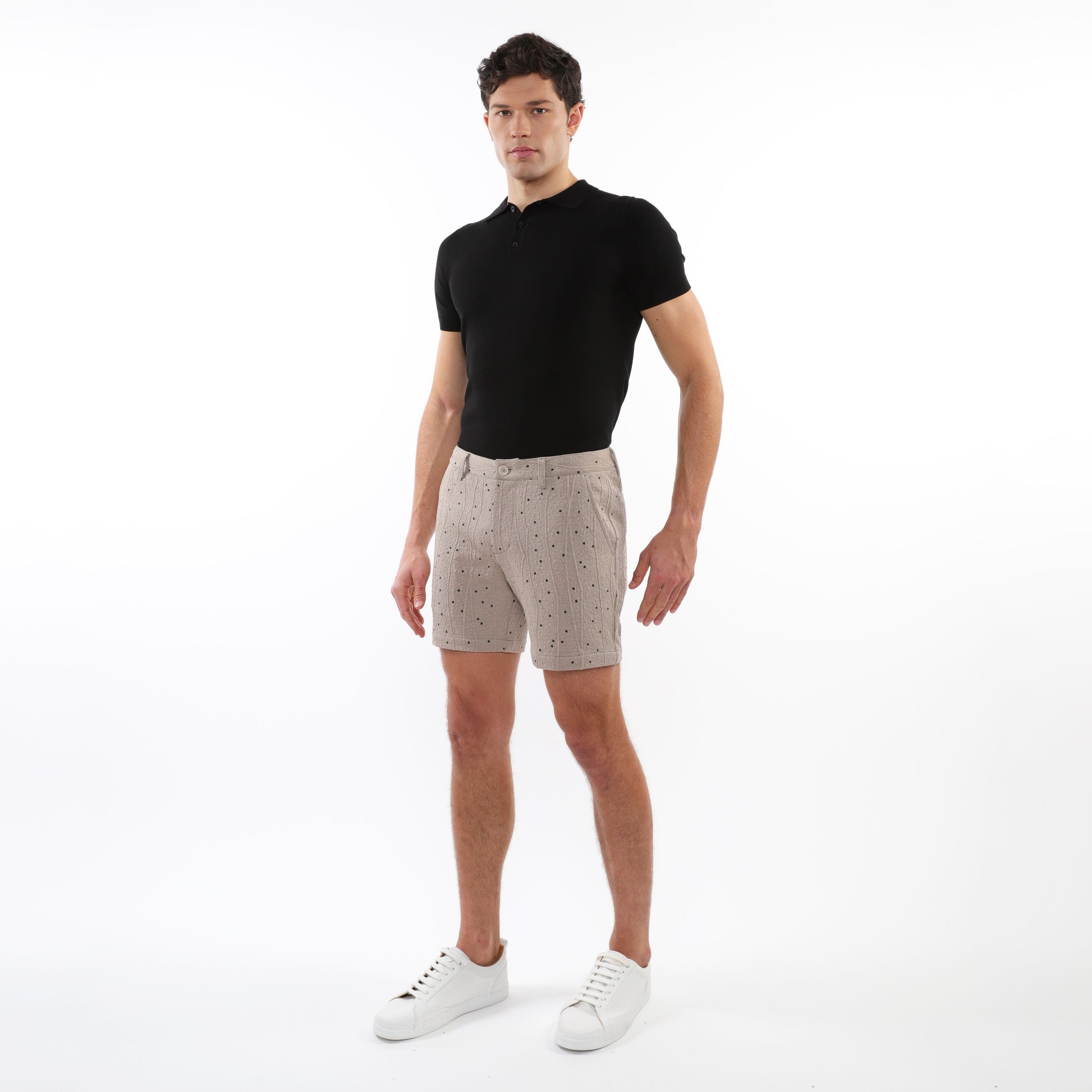 Beige textured jacquard stretch chino shorts with subtle dark dot pattern made from lightweight fabric