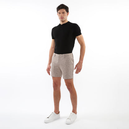 Beige textured jacquard stretch chino shorts with subtle dark dot pattern made from lightweight fabric