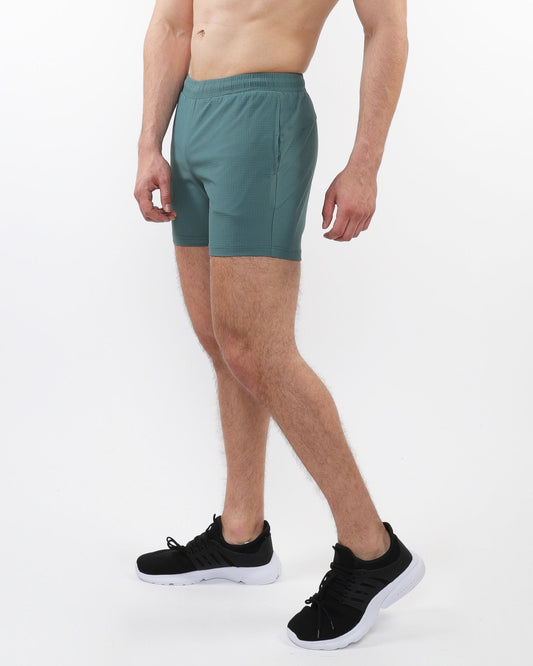 Teal textured mesh stretch performance athletic shorts with elastic waistband and side pockets for active wear