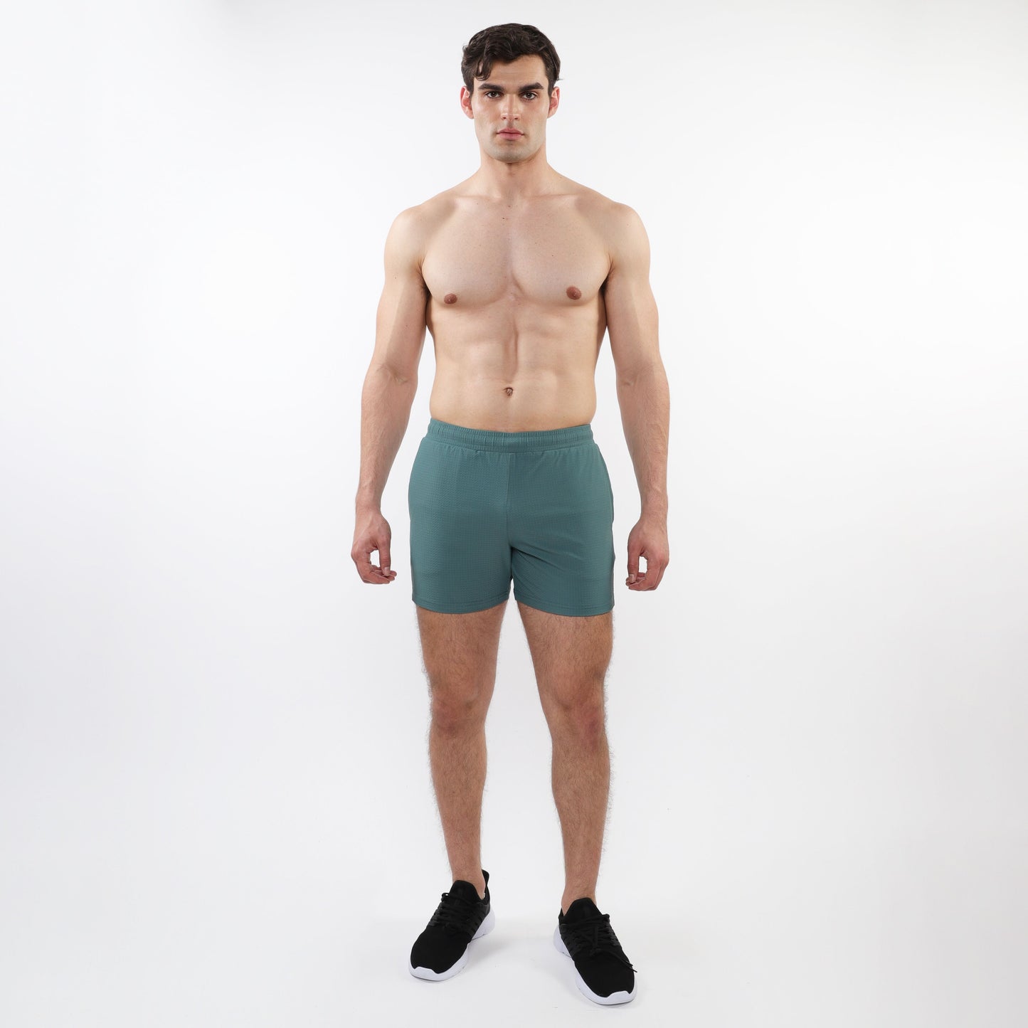 Teal textured mesh stretch performance shorts with elastic waistband designed for athletic use