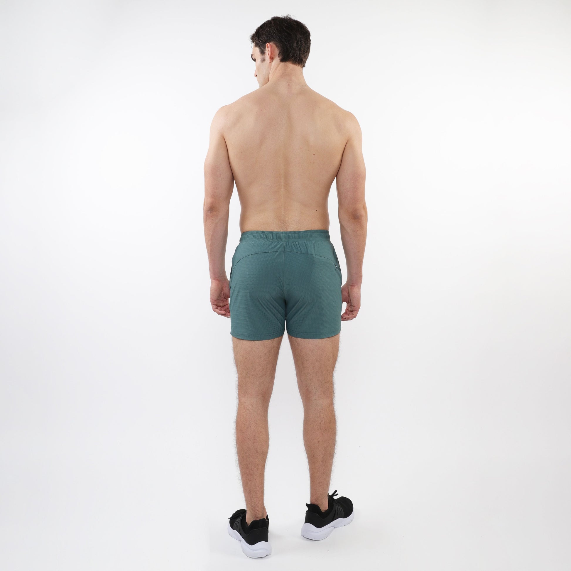Teal textured mesh stretch performance shorts with a sleek modern design and elastic waistband