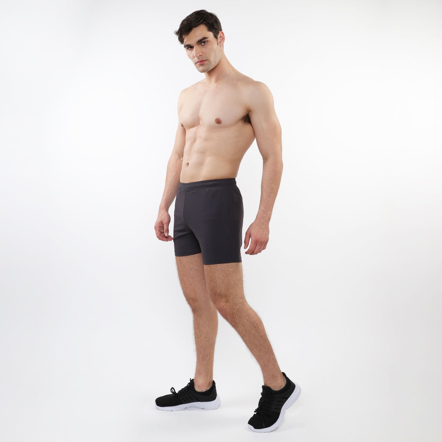 Black textured mesh stretch performance shorts with sleek form-fitting design for athletic use