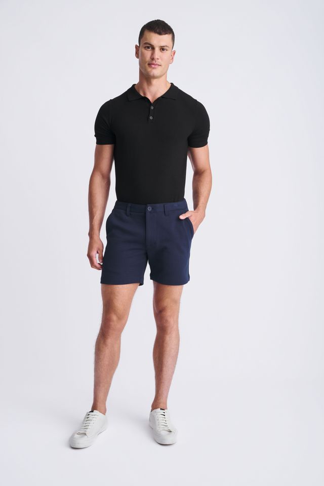 Navy blue textured stretch knit chino shorts with classic fit and button closure perfect for casual wear