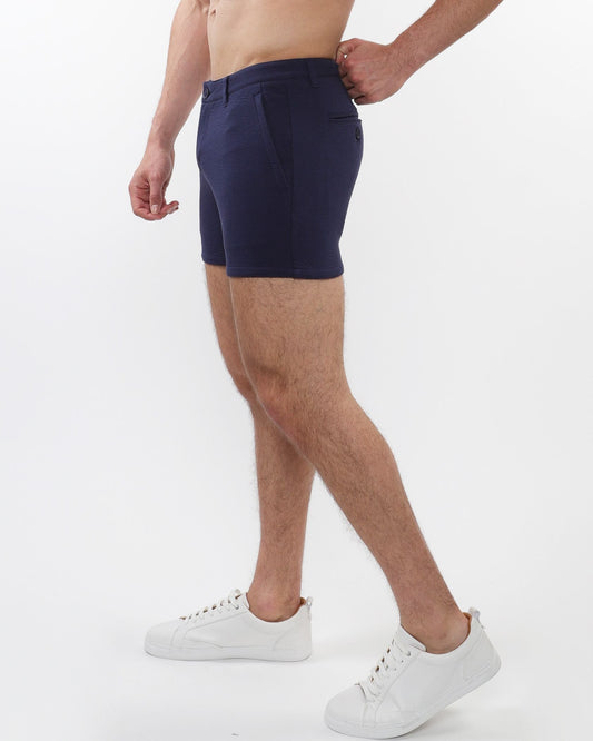 Navy blue textured stretch knit chino shorts for men with sleek tailored fit and subtle zip side pockets
