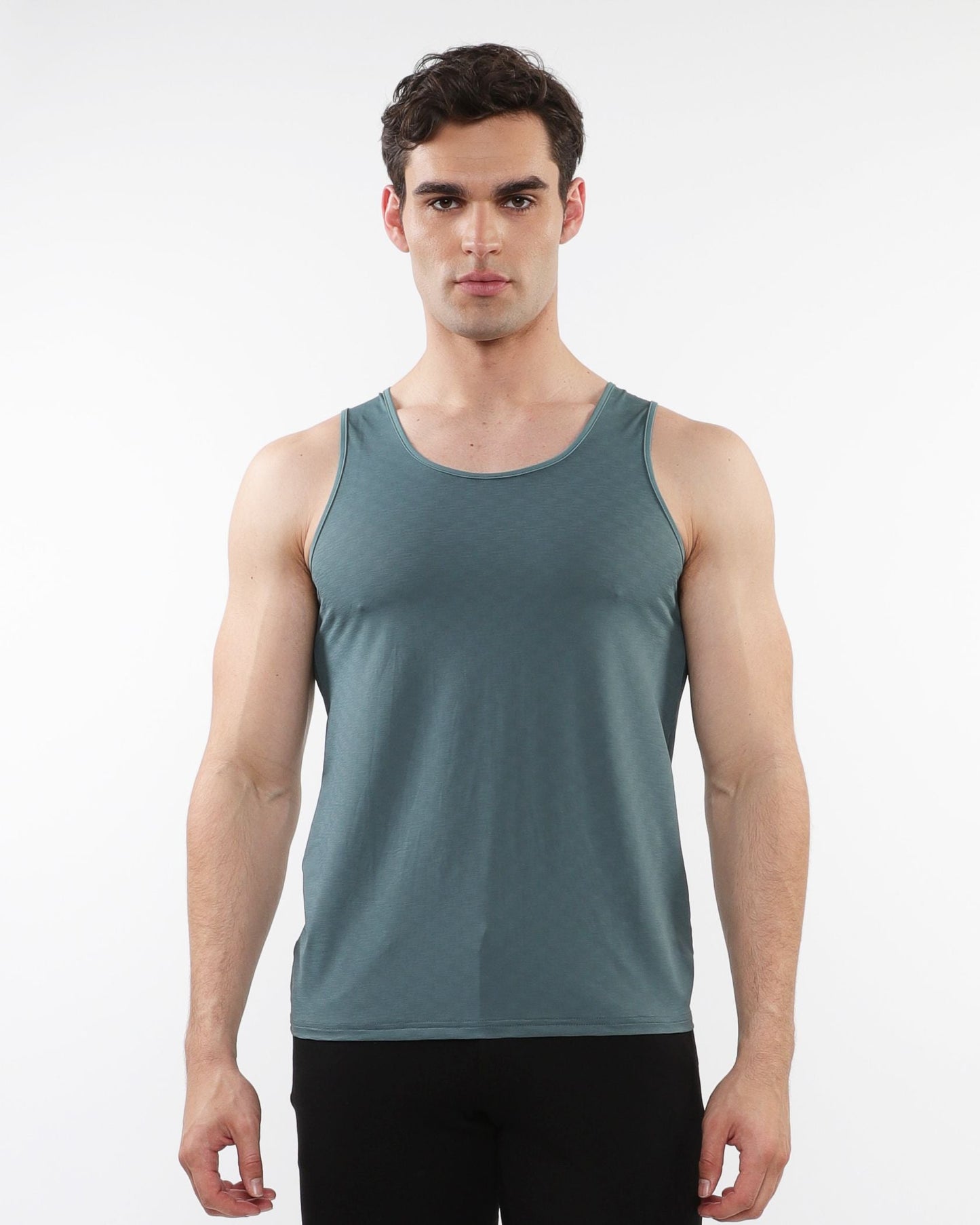A sleek teal textured stretch mesh performance tank top with moisture-wicking fabric and a round neckline