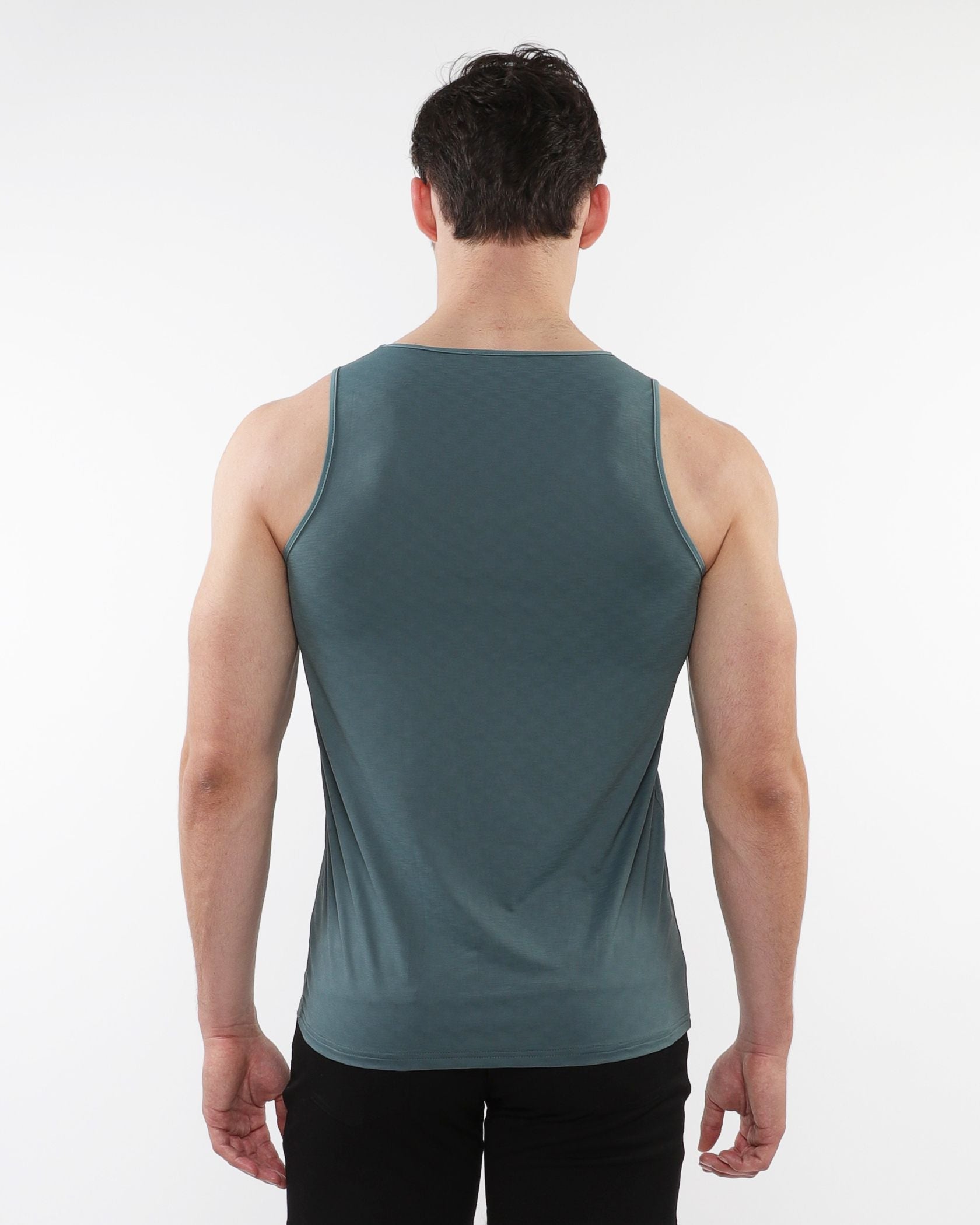 A sleek dark teal sleeveless textured stretch mesh performance tank with smooth form-fitting fabric