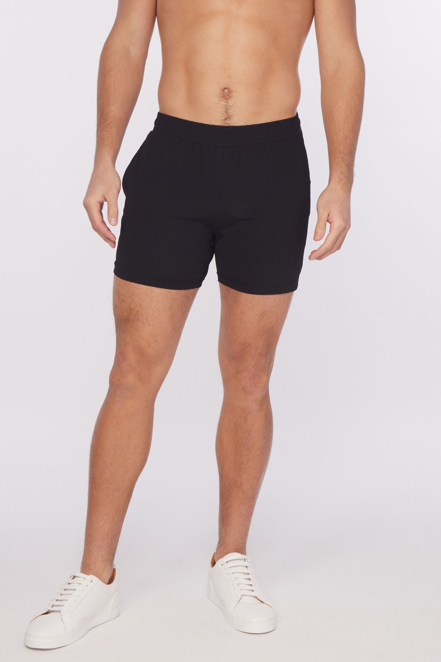 Black textured stretch performance athletic shorts with snug fit and elastic waistband for active wear