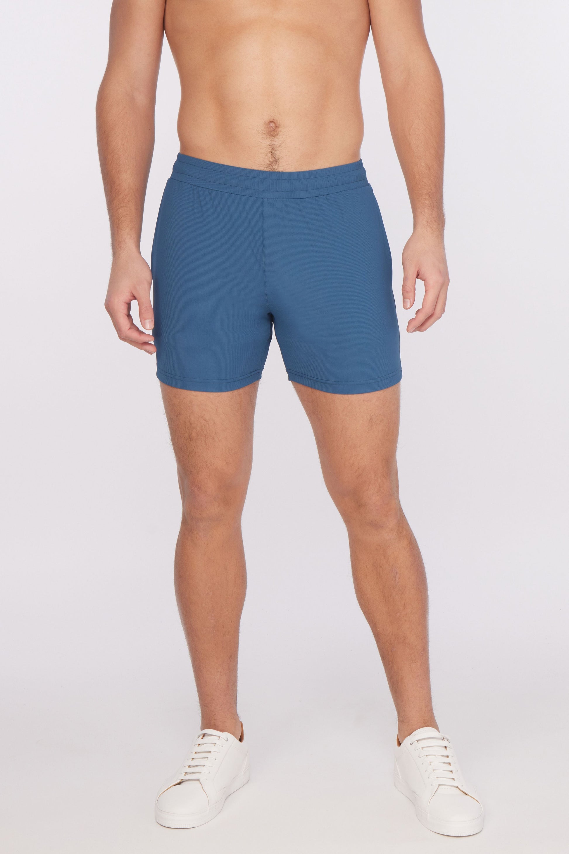 Blue textured stretch performance shorts with fitted waistband and minimalist design for athletic use