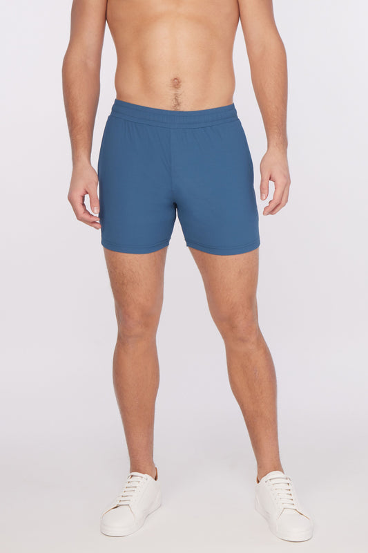 Blue textured stretch performance shorts with fitted waistband and minimalist design for athletic use