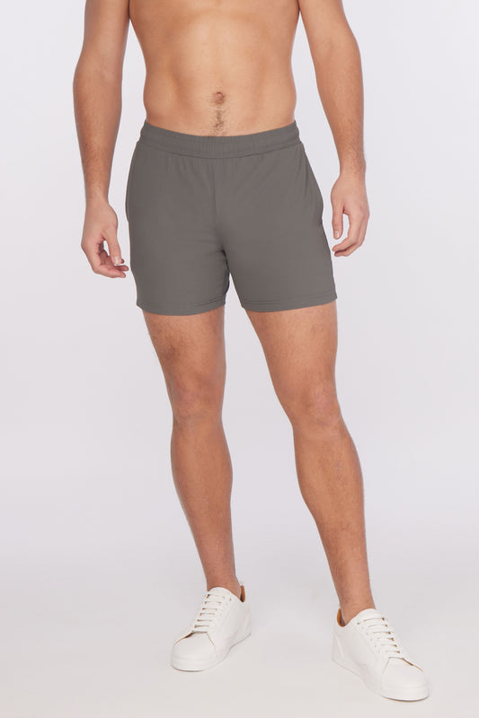 Gray textured stretch performance athletic shorts with a comfortable elastic waistband and subtle side pockets