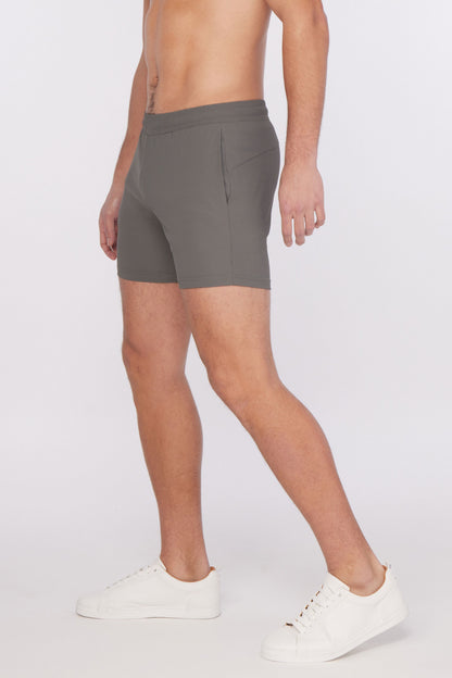 Gray textured stretch performance shorts with sleek form-fitting design and subtle side pockets for athletic use