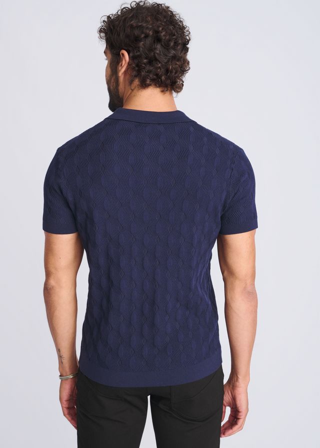 Navy blue cable-knit polo shirt featuring textured stripes made from silk and tencel for a refined look