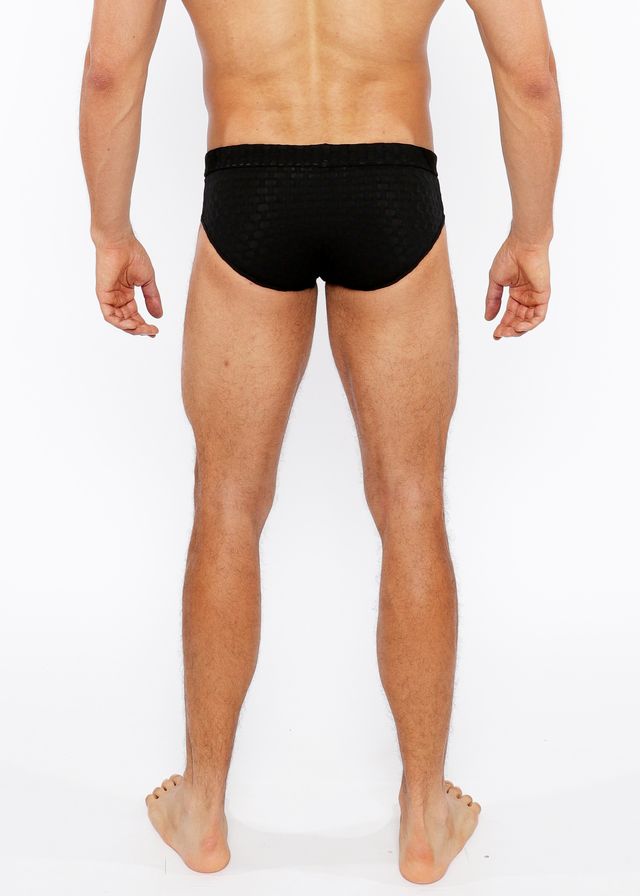 Black textured swim brief with front buckle made from durable fabric for stylish swimwear use