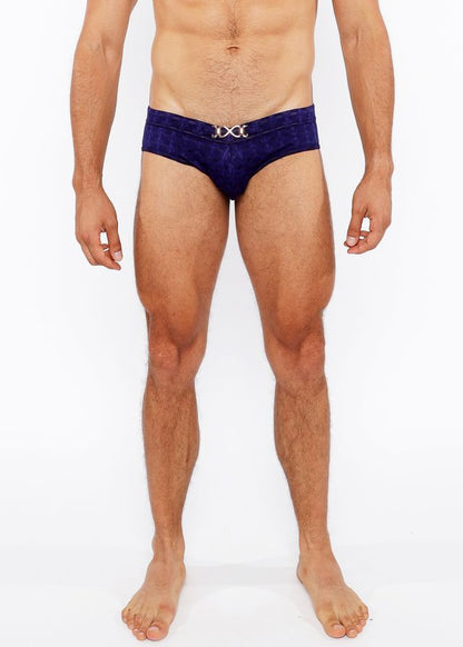 Deep blue velvet textured swim brief with a silver metallic x shaped front buckle for stylish swimwear