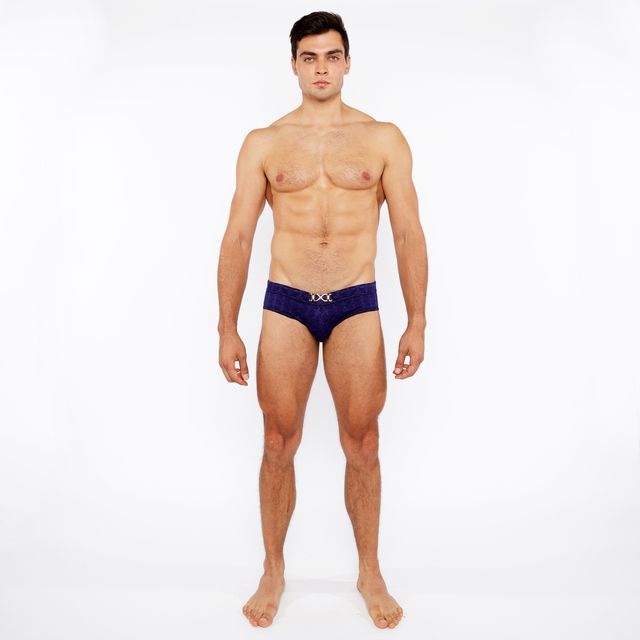 Navy blue textured swim brief with front buckle and metallic silver logo on the waistband for men