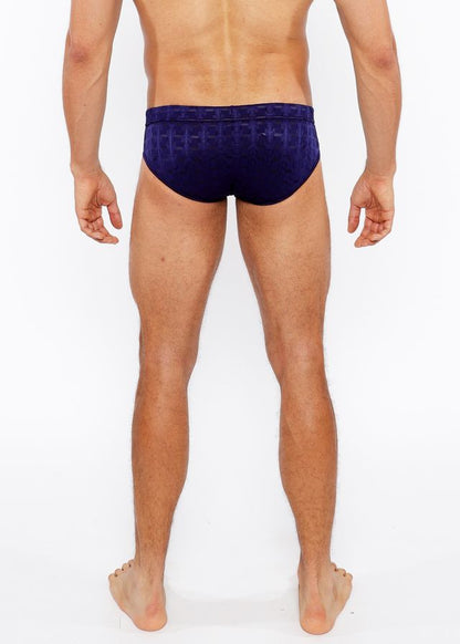 Navy blue textured swim brief with front buckle featuring a geometric pattern ideal for swimming and beachwear