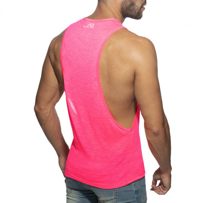 A vibrant pink thin flame low rider sleeveless athletic tank top with deep back cutout and subtle logo at neckline