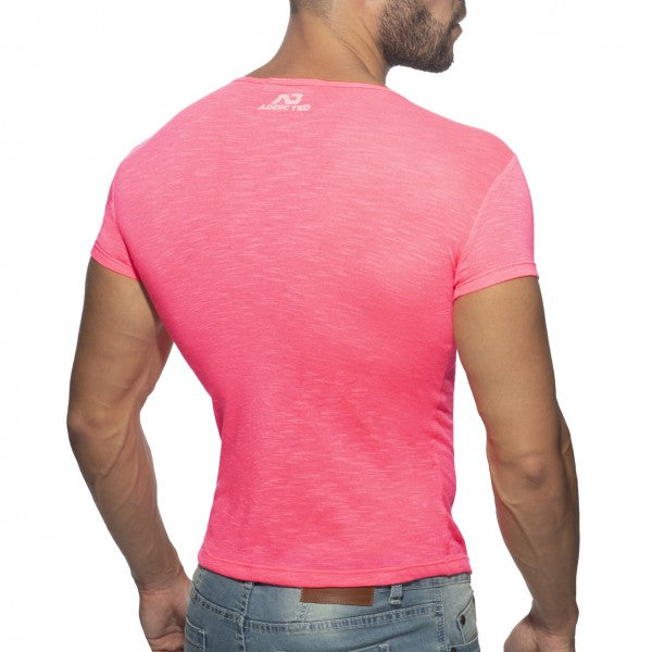 Back view of a vibrant pink thin flame short-sleeved men’s t-shirt with subtle textured fabric and arena logo