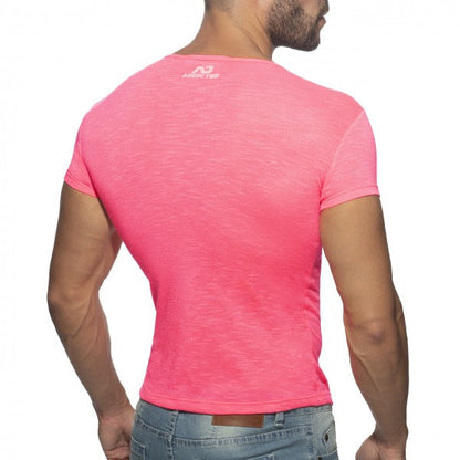 Back view of a vibrant pink thin flame short-sleeved men’s t-shirt with subtle textured fabric and arena logo