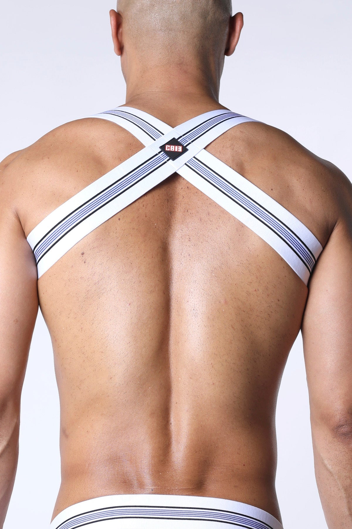 White and navy striped cross-back men’s tight end elastic harness underwear with small black logo patch at center back