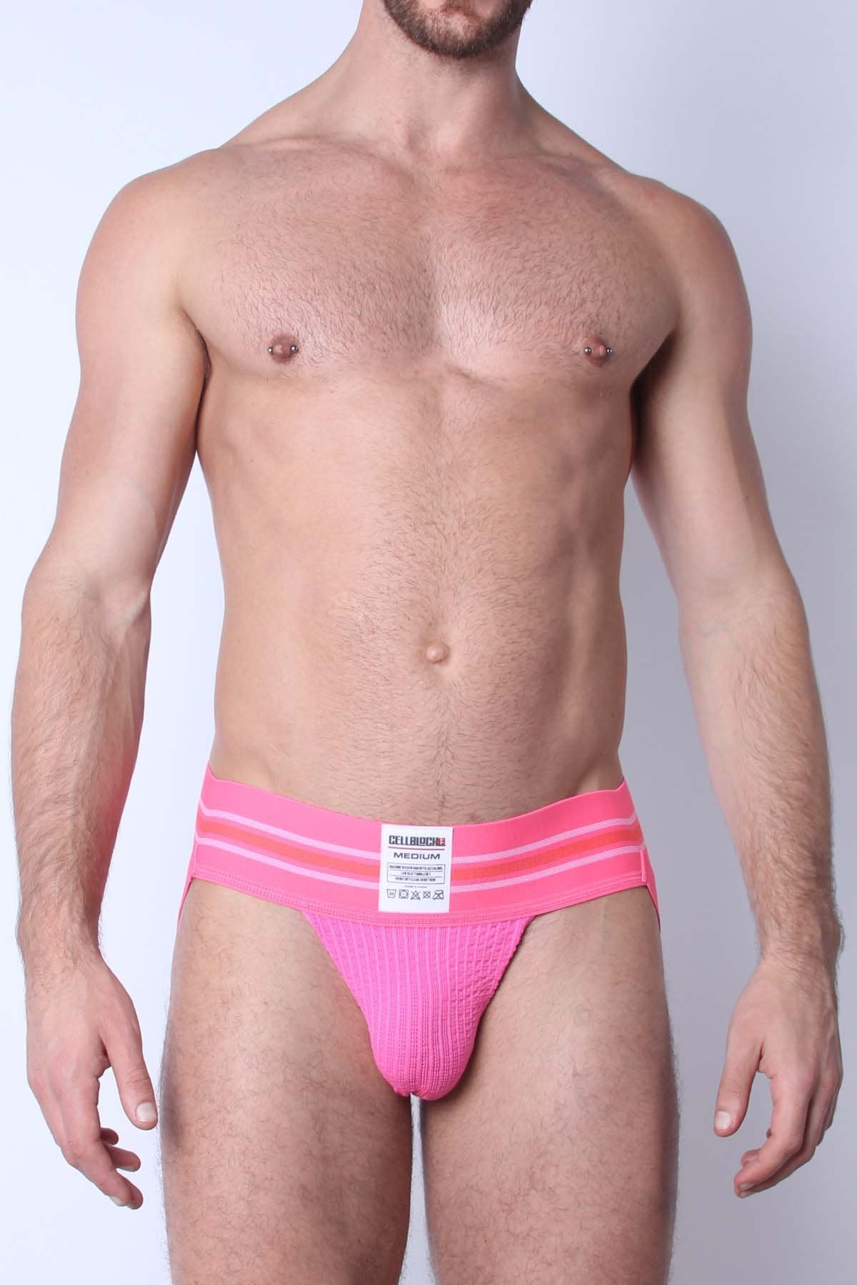 Bright pink tight end jockstrap briefs with ribbed texture and two horizontal waistband stripes