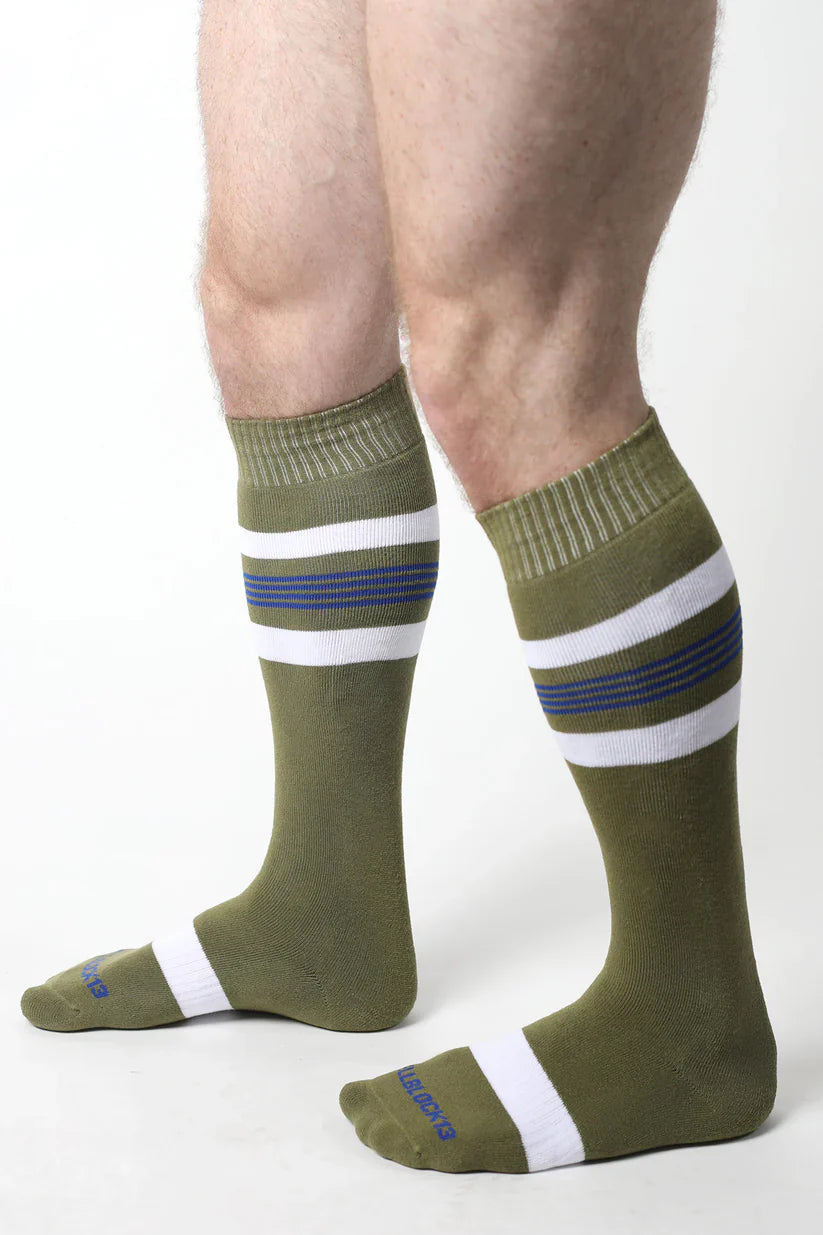 Olive green tight end knee high athletic socks with white and navy horizontal stripes and ribbed cuff and toe design