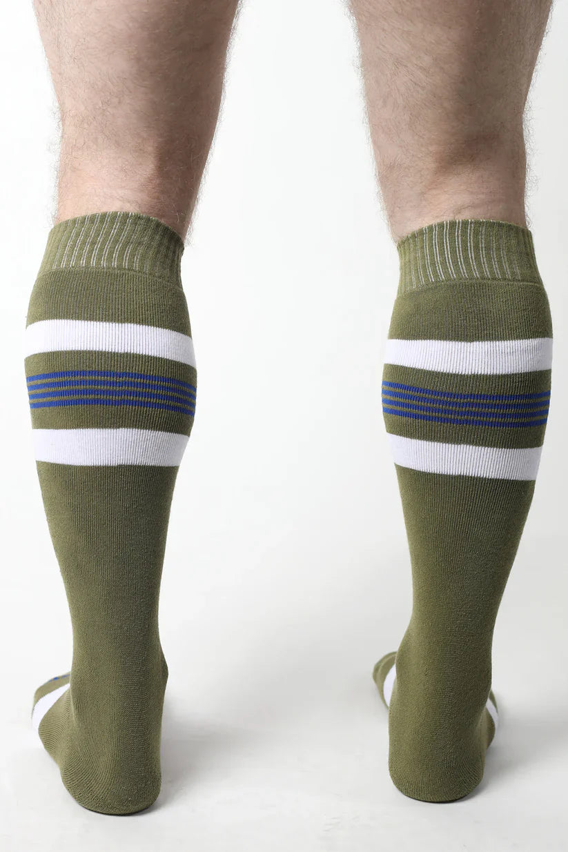 Olive green tight end knee high socks with two white stripes thin blue lines and ribbed cuffs