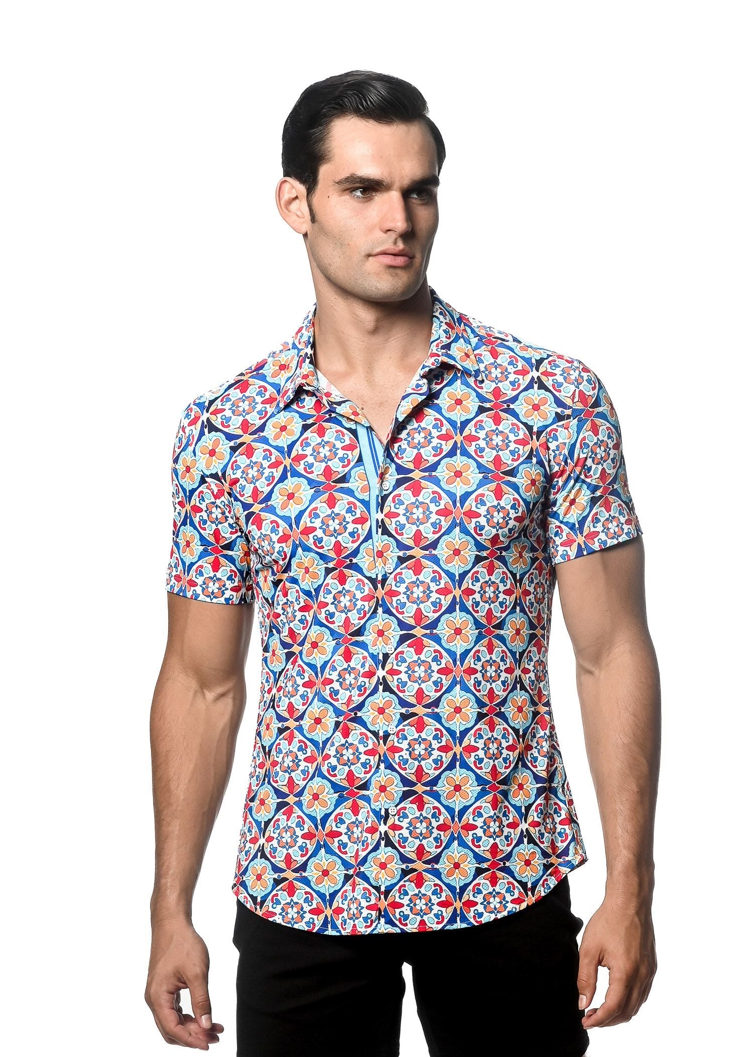 A man wearing a tile printed performance short-sleeved shirt with a vibrant blue red and white geometric pattern and contrast placket