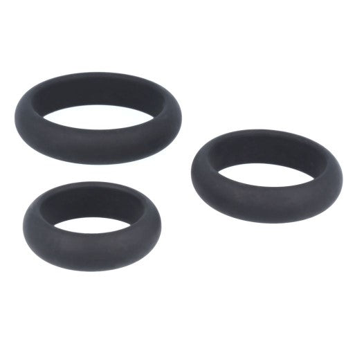 Three black silicone rings of varying sizes on a white background.