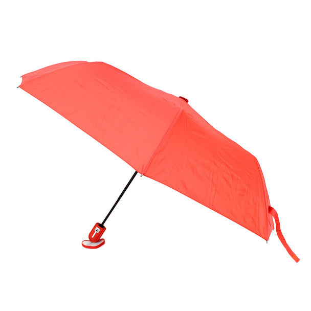 A vibrant coral travel umbrella with a sleek black handle and red clip-on base for compact use