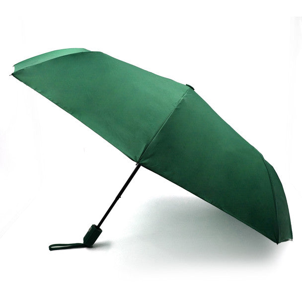 A sleek dark green travel umbrella with black handle and grip designed for compact convenience and durability