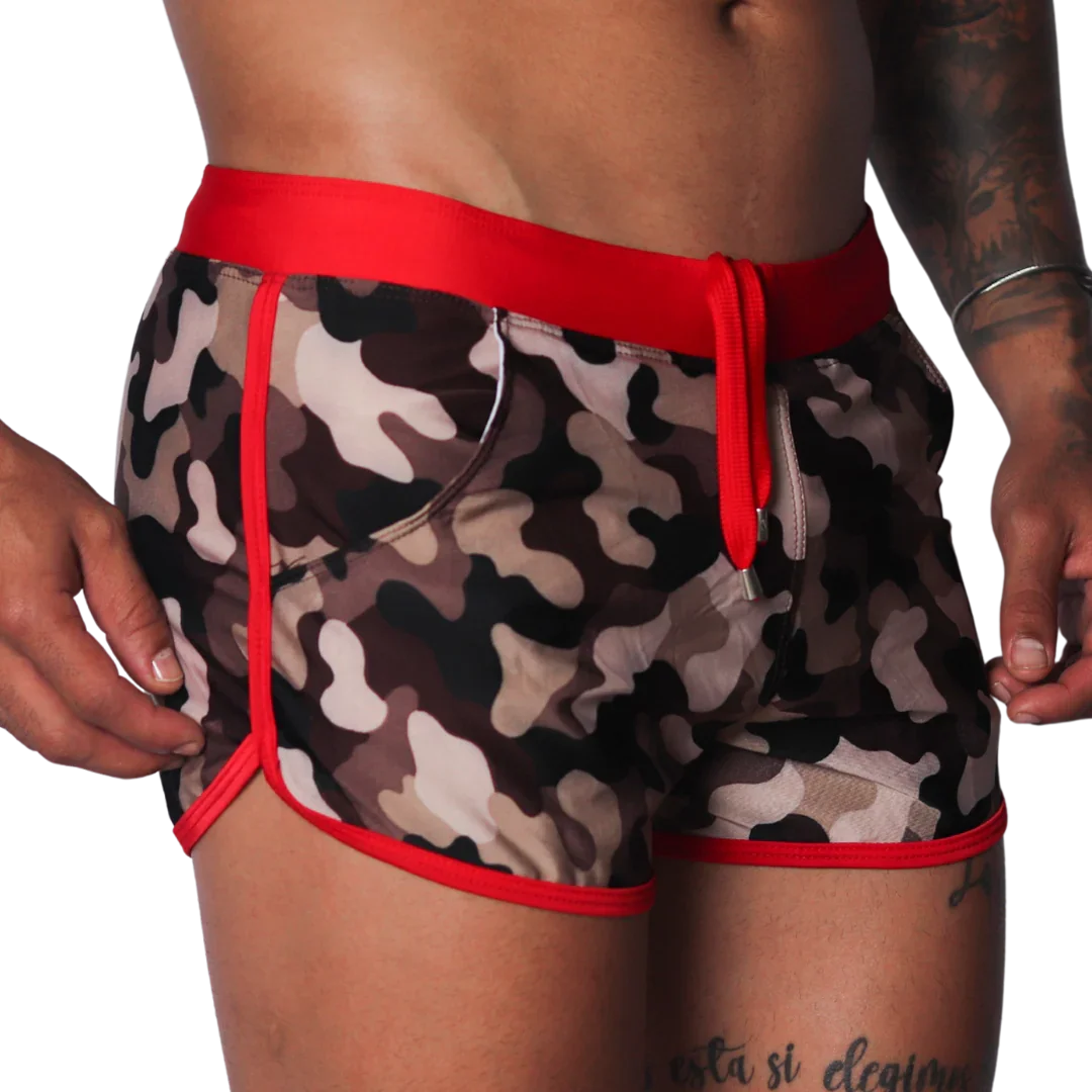 Men's camouflage print swim shorts with red trim, elastic waistband, and matching drawstring.