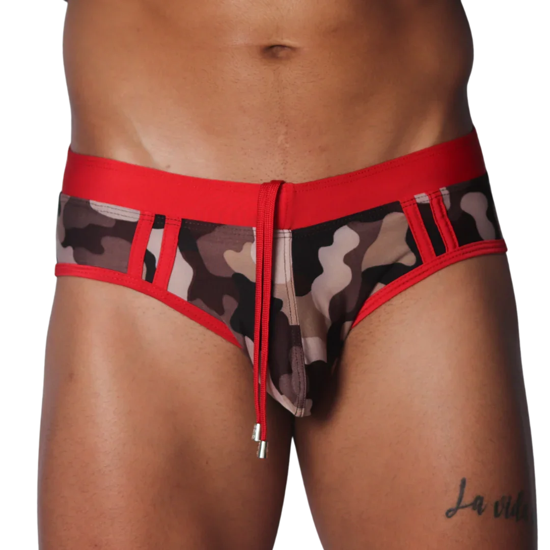 Camo print swim brief with red waistband, trim, and central drawstring featuring metallic aglets.
