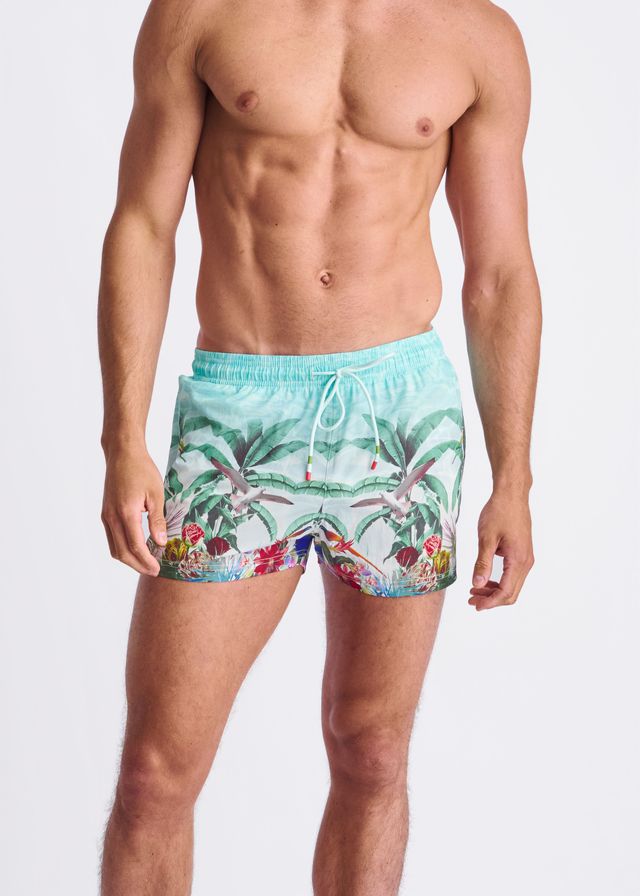Light blue tropics print swim shorts with vibrant palm trees birds flowers and mesh lining for comfort