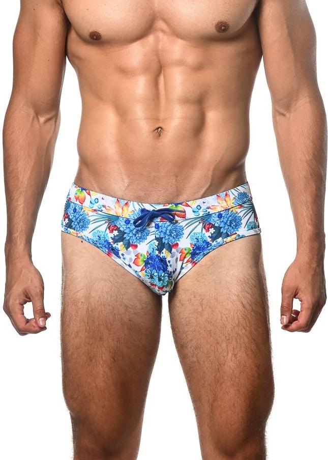 Tropics printed swim brief with vibrant blue and multicolored tropical floral pattern and matching drawstring waistband
