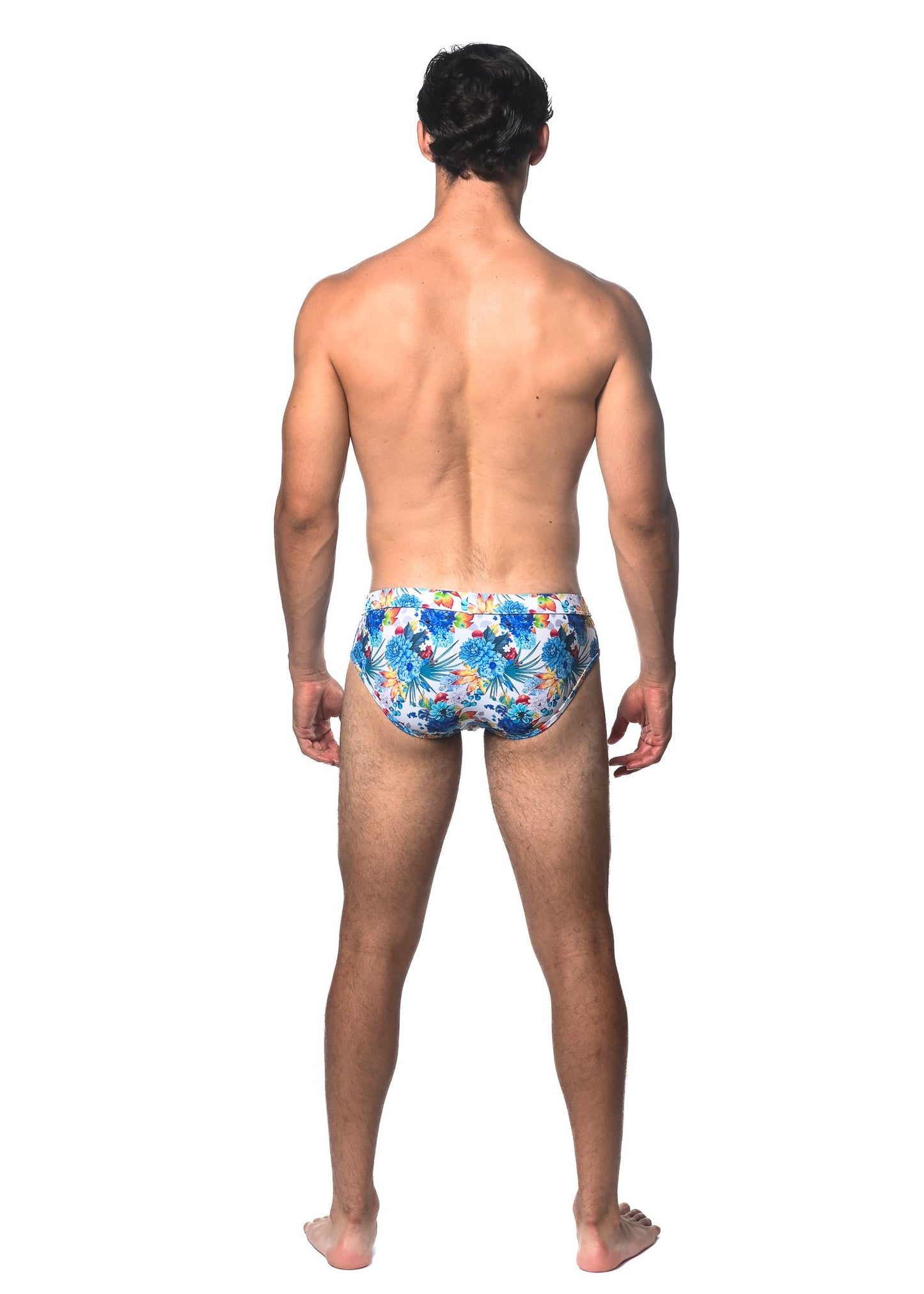 Tropics printed swim brief featuring blue and yellow floral patterned swim trunks for beachwear